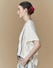 Define T-shirt in ivory jersey with ribbons and ruffles