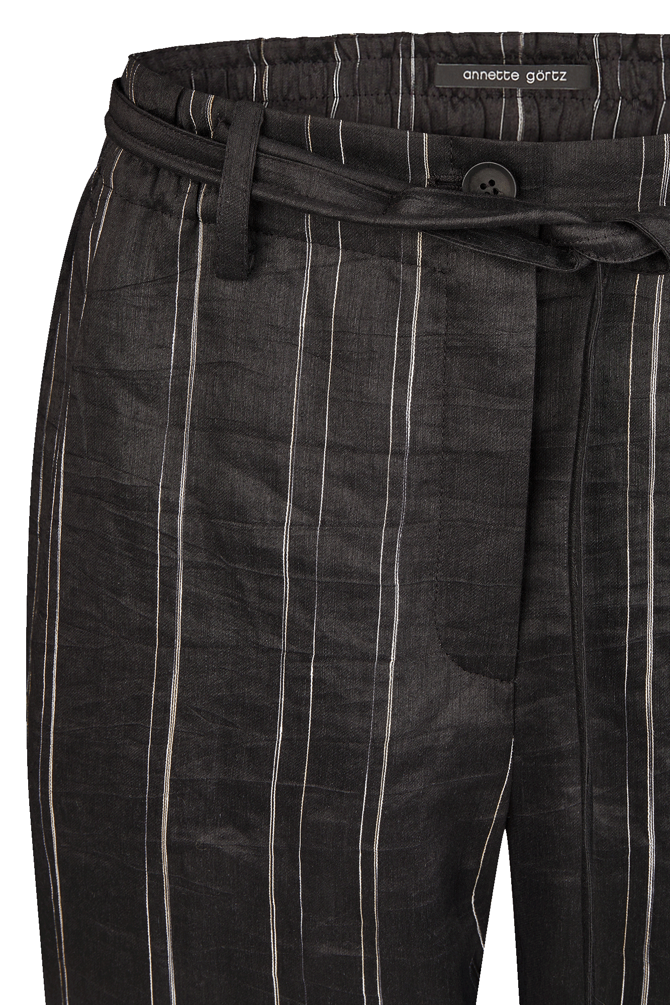 Black/white pants with an elastic waistband and tie belt.