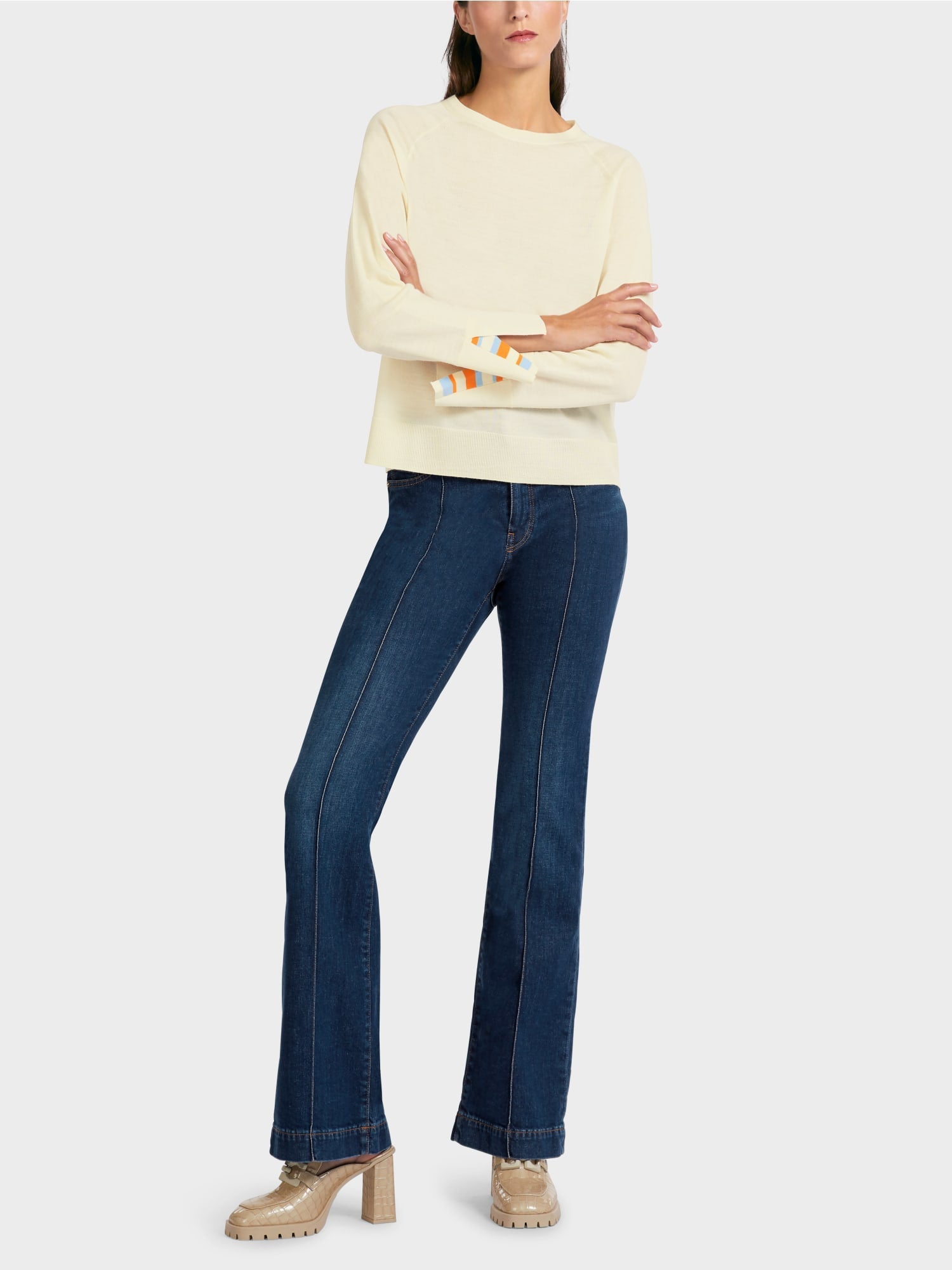 Knit sweater with contrast sleeve slit