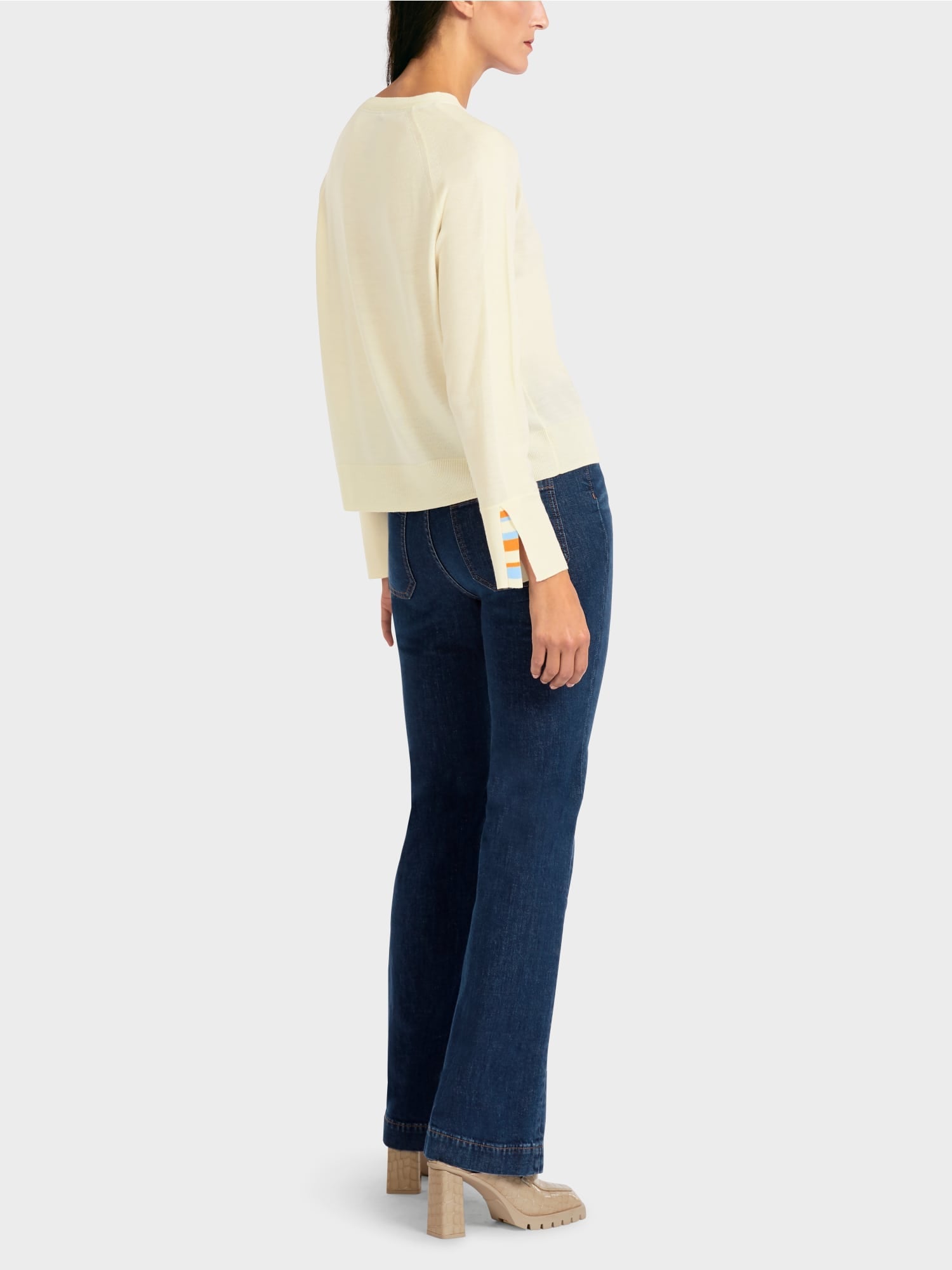 Knit sweater with contrast sleeve slit