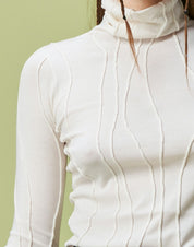 Ivory Rollneck sweater with raised and curved seams