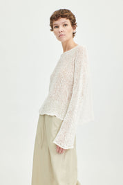 Casual pullover made of coated yarn with a papery feel