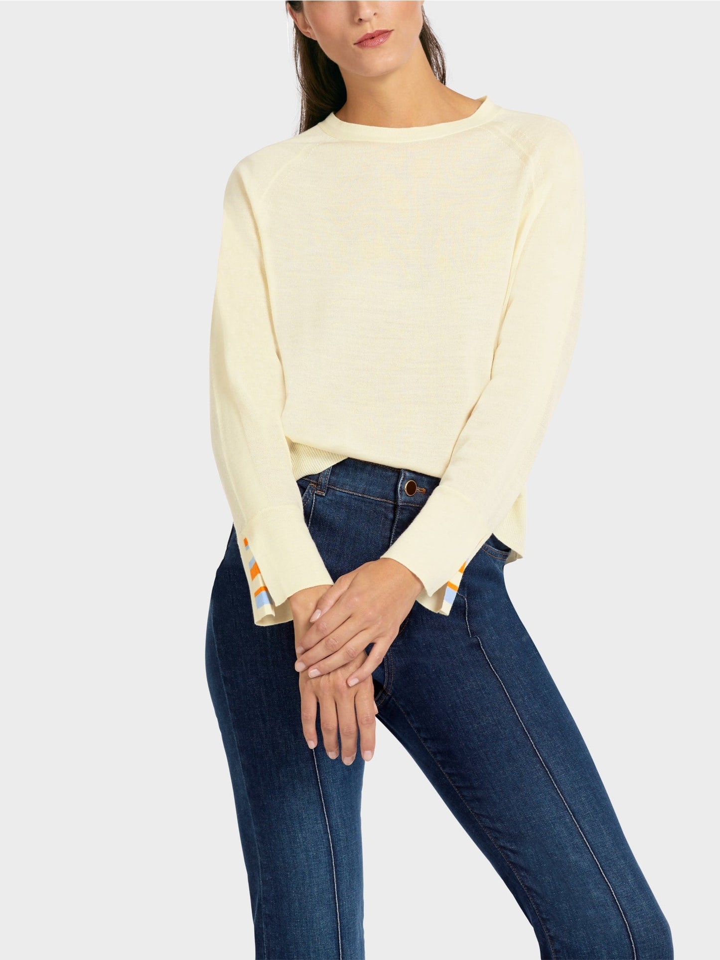 Knit sweater with contrast sleeve slit