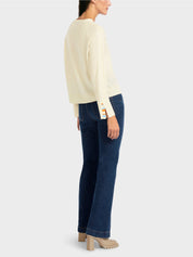 Knit sweater with contrast sleeve slit