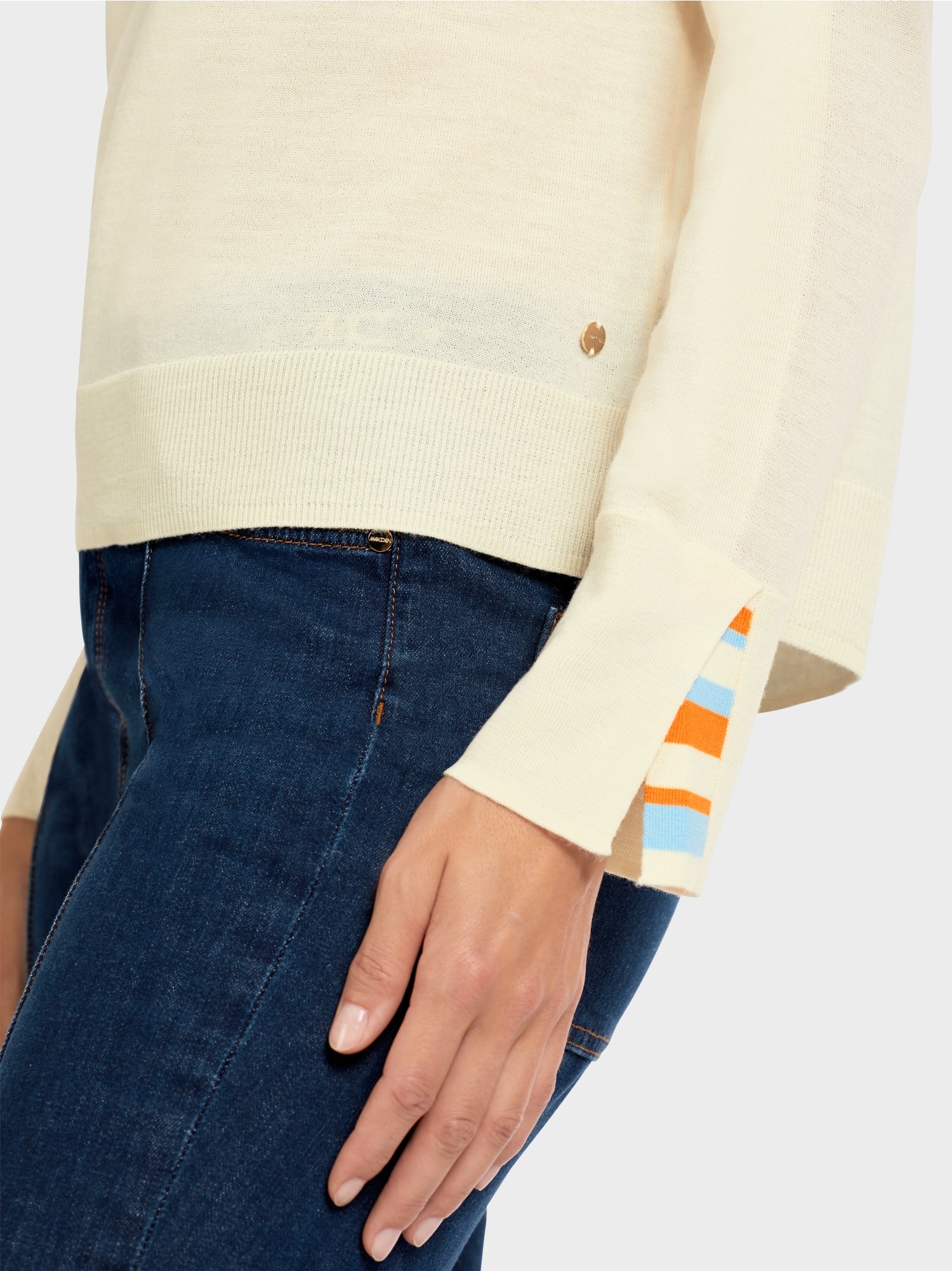 Knit sweater with contrast sleeve slit