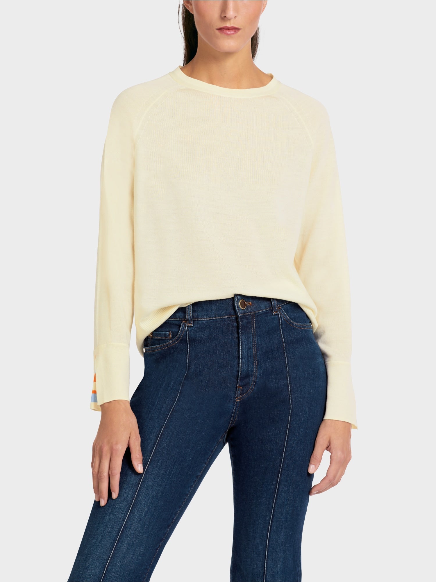Knit sweater with contrast sleeve slit